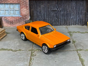 Custom Matchbox Volkswagen Golf GTI Mk1, Metallic orange with chrome wheels, three-quarter view
