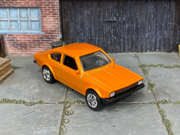Custom Matchbox Volkswagen Golf GTI Mk1, Metallic orange with chrome wheels, three-quarter view