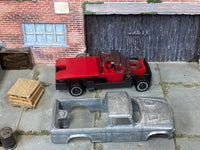 Disassembled 1963 Studebaker Champ kit with bare-metal body and rolling chassis