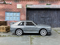 Dry-fitted bare-metal 1984 Audi Sport Quattro custom kit, side view
