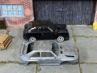 Disassembled 1984 Audi Sport Quattro kit with bare-metal body and rolling chassis