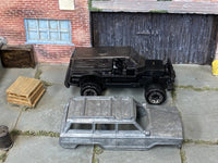Disassembled 1988 Jeep Wagoneer 4x4 kit with bare-metal body and rolling chassis