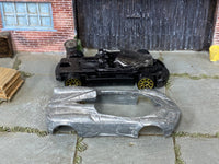 Disassembled 2017 Pagani Huayra kit with bare-metal body and rolling chassis