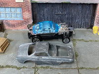 Dry-fitted bare-metal Volvo P1800 Gasser custom kit, side view