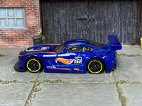 Hot Wheels '16 Mercedes-AMG GT3 blue 71, left side view with yellow-rim wheels