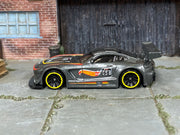 Hot Wheels '16 Mercedes-AMG GT3 metallic dark gray number 68, left side view