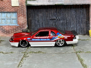 Hot Wheels 1988 Ford T-Bird red Vetuskey Motor Co. number 088 loose car, left-side view