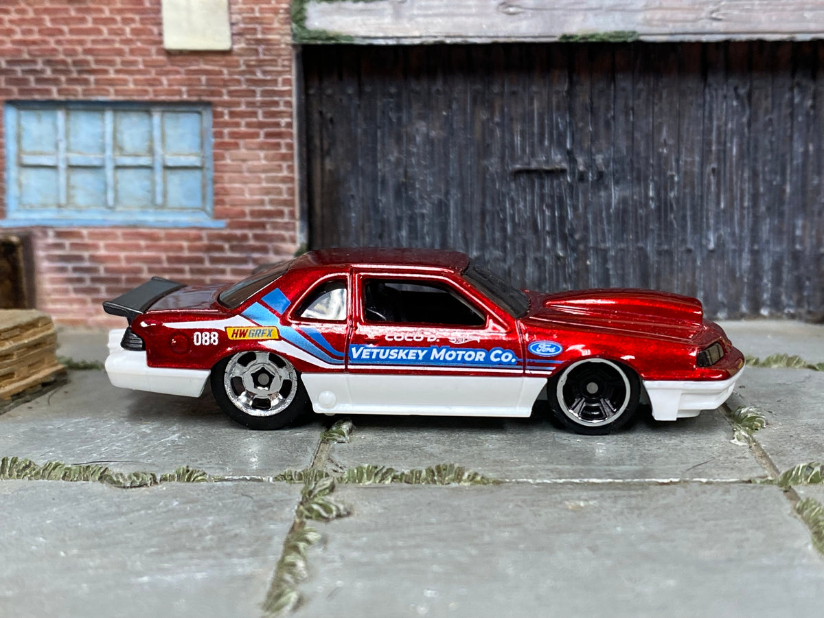 Hot Wheels 1988 Ford T-Bird red Vetuskey Motor Co. number 088 loose car, right-side view