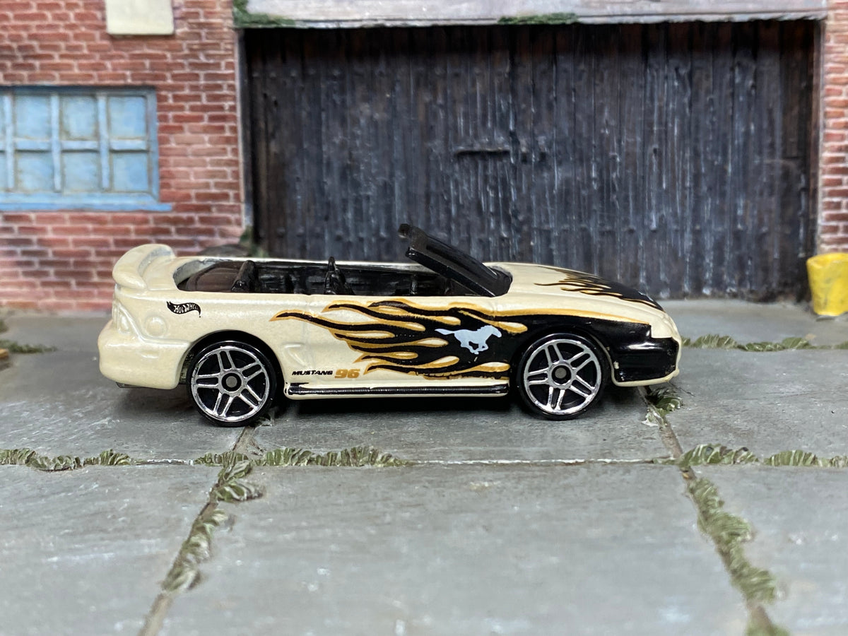 Hot Wheels 1996 Mustang GT pearl white with black and gold flames loose car, right side view