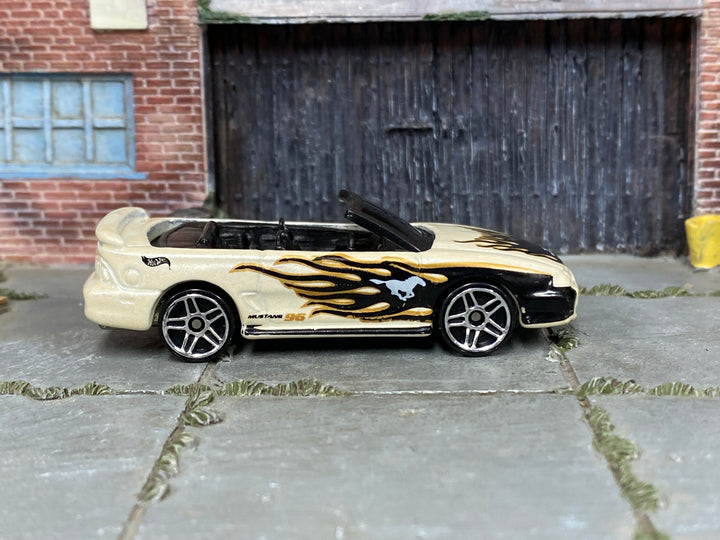Hot Wheels 1996 Mustang GT pearl white with black and gold flames loose car, right side view