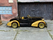Hot Wheels 1998 Auburn 852 black and gold left-side view