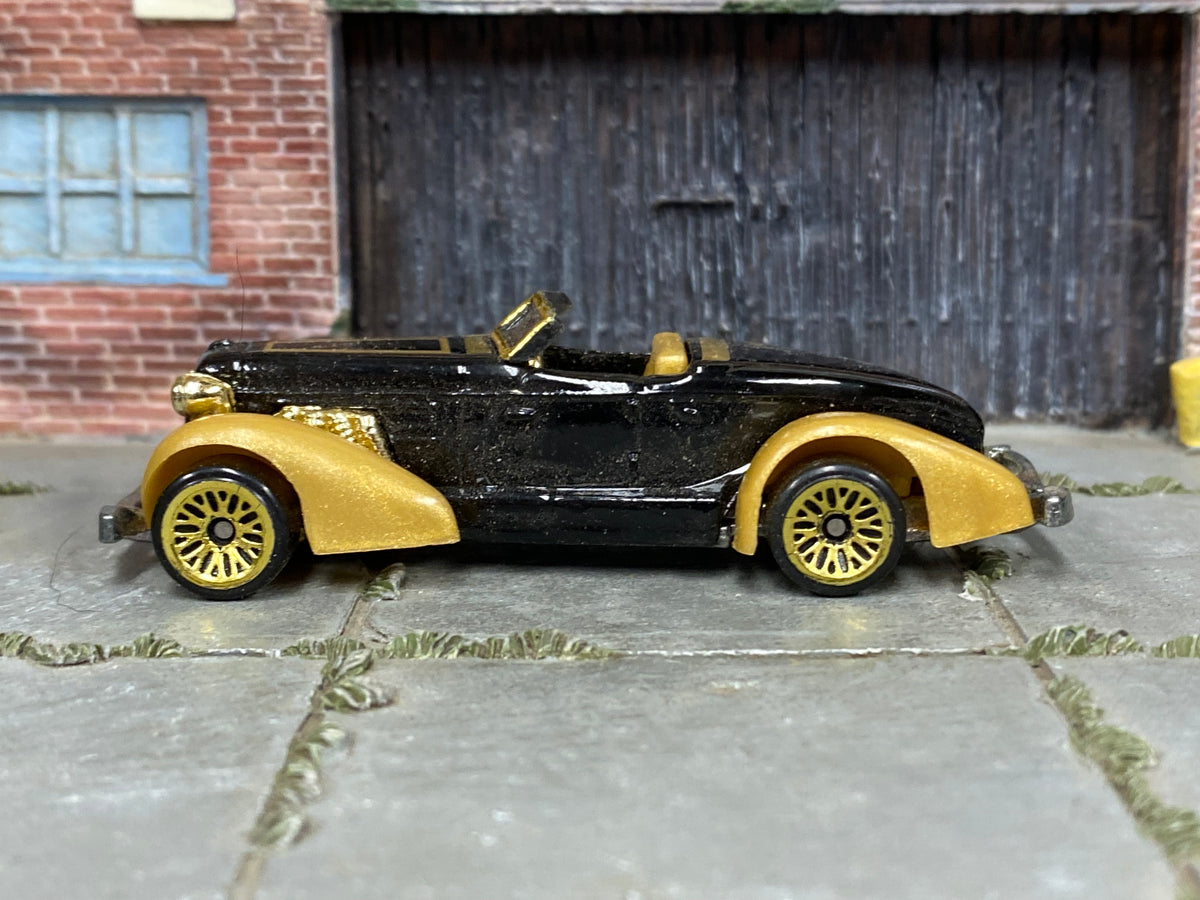 Hot Wheels 1998 Auburn 852 black and gold right-side view