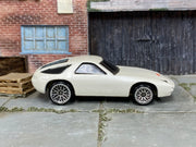 Hot Wheels 1998 Porsche 928 pearl white left-side view