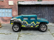 Hot Wheels 1999 Humvee teal B Man left-side view