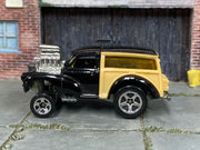 2001 Hot Wheels Morris Wagon black and tan First Edition 28759 loose car, left-side view