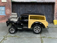 2001 Hot Wheels Morris Wagon black and tan First Edition 28759 loose car, left-side view