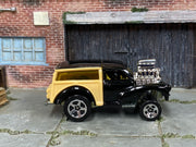 2001 Hot Wheels Morris Wagon black and tan First Edition 28759 loose car, right-side view