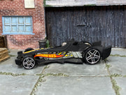 2004 Hot Wheels F-Racer matte black B3531 First Editions loose car, left-side view