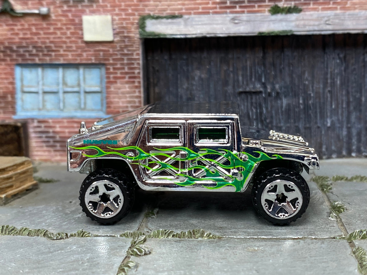 2006 Hot Wheels Humvee chrome with green flames J3393 loose truck, right-side view
