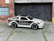 Hot Wheels 2013 Toyota AE-86 Corolla white and black left-side view