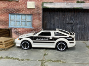 Hot Wheels 2013 Toyota AE-86 Corolla white and black right-side view