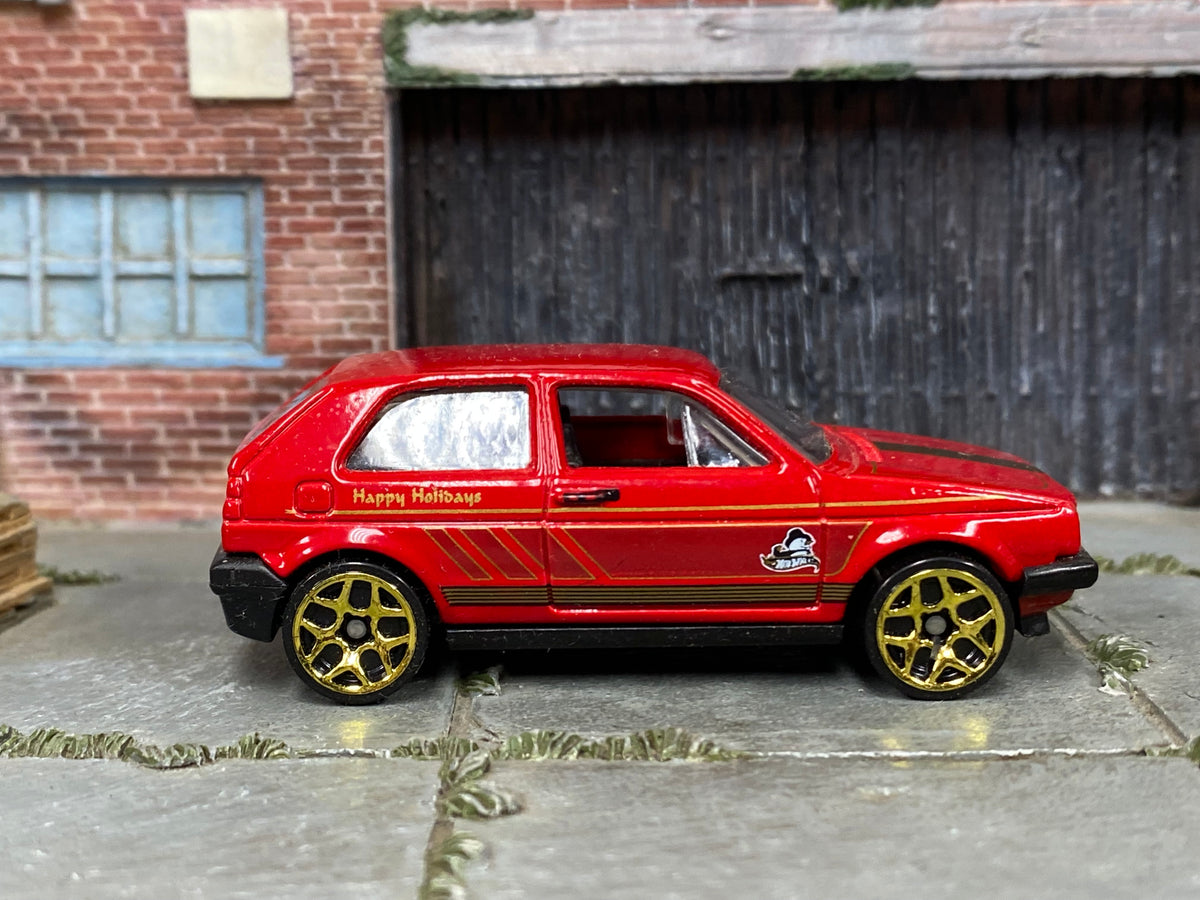 Hot Wheels 2014 Volkswagen Golf Holiday Hot Rods red right-side view