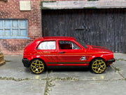 Hot Wheels 2014 Volkswagen Golf Holiday Hot Rods red right-side view