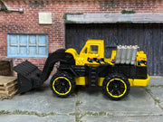 2014 Hot Wheels Wheel Loader yellow BFC33 loose construction vehicle, left-side view