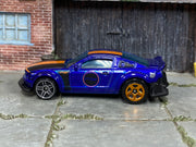 Hot Wheels 2010 Ford Mustang GT purple and orange loose car with mixed wheels, left-side view