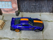 Hot Wheels 2010 Ford Mustang GT purple and orange loose car with mixed wheels, top view