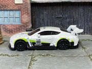 Hot Wheels 2018 Bentley Continental GT3 white and lime number 100 — left side view