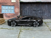 2019 Hot Wheels Aston Martin DBS black HW Exotics loose car, left-side view