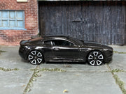 2019 Hot Wheels Aston Martin DBS black HW Exotics loose car, right-side view