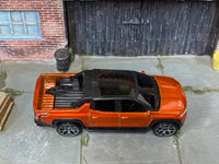 Hot Wheels 2022 GMC Hummer EV orange top view