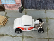 2023 Hot Wheels Max Steel white and red number 28 HKH39 loose car, top view