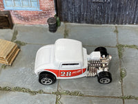 2023 Hot Wheels Max Steel white and red number 28 HKH39 loose car, top view