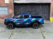 2024 Hot Wheels '19 Ford Ranger Raptor dark blue HKS loose truck, left-side view