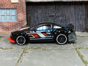2024 Hot Wheels Gazella R black Nightburnerz loose car, left-side view