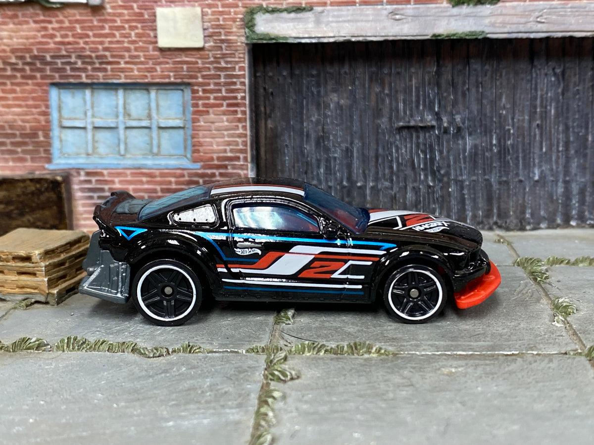 2024 Hot Wheels Gazella R black Nightburnerz loose car, right-side view