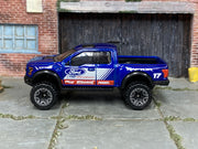 2025 Hot Wheels '17 Ford F-150 Raptor metalflake blue number 17 loose truck, left-side view