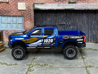 2025 Hot Wheels '19 Chevy Silverado Trail Boss LT blue number 1020 loose truck, left-side view
