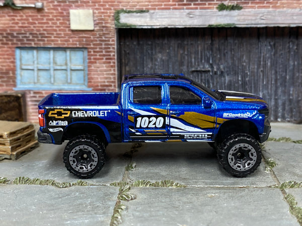 2025 Hot Wheels '19 Chevy Silverado Trail Boss LT blue number 1020 loose truck, right-side view