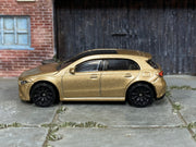 2025 Hot Wheels '19 Mercedes-Benz A-Class metalflake gold H7045 loose car, left-side view