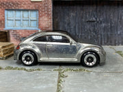 2025 Hot Wheels 2012 Volkswagen Beetle ZAMAC loose car, right-side view