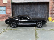 Hot Wheels 2025 '67 Mustang black Muscle Mania left-side view
