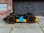 2025 Hot Wheels Flippin Fast black and orange HYY58 loose car, left-side view