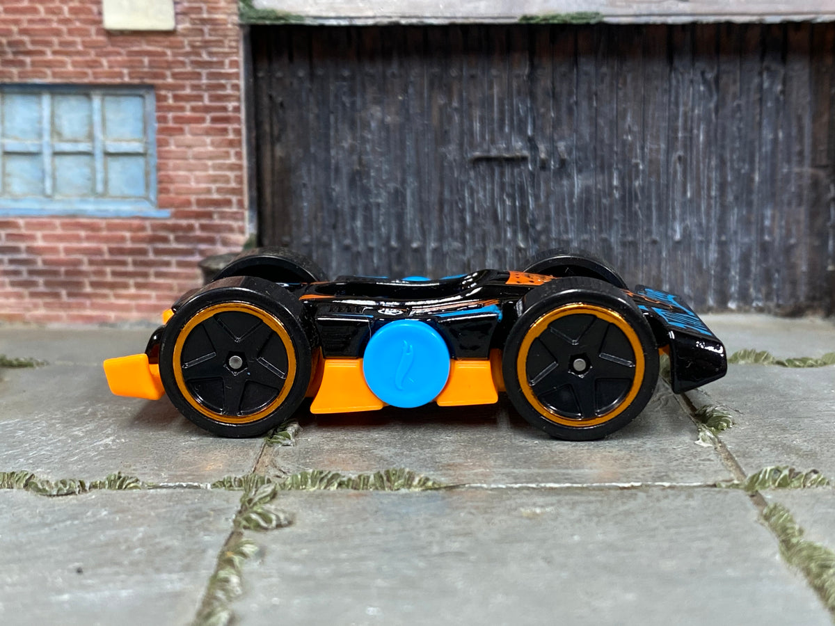 2025 Hot Wheels Flippin Fast black and orange HYY58 loose car, right-side view