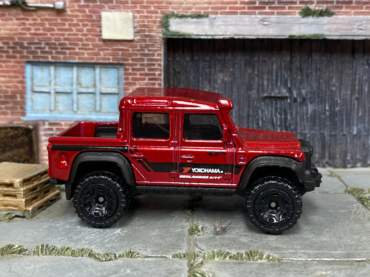 2025 Hot Wheels '15 Land Rover Defender Double Cab red Yokohama loose truck, right-side view