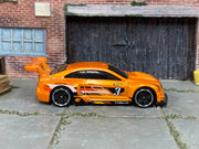 Hot Wheels 2026 '16 Cadillac ATS-V R orange left-side view