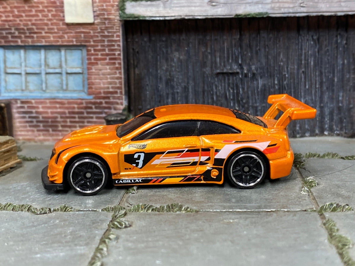 Hot Wheels 2026 '16 Cadillac ATS-V R orange right-side view
